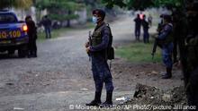 24.10.2021
A soldier stands around a perimeter during raids in El Estor, at the northern coastal province of Izabal, Guatemala, Sunday, Oct. 24, 2021. The Guatemalan government has declared a month-long, dawn-to-dusk curfew and banned pubic gatherings following two days of protests against a mining project. (AP Photo/Moises Castillo)