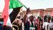A Sudanese demonstrator waves a national flag as he shouts slogans during a rally against the military chief A Sudanese demonstrator waves a national flag as he shouts slogans during a rally against the military chief