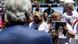 Foto de una persona que sostiene una imagen de una de las víctimas de 2001 frente a Alberto Fernandez. Foto de una persona que sostiene una imagen de una de las víctimas de 2001 frente a Alberto Fernandez.