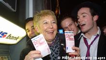 399125 01: A woman holds up Euro notes that she withdrew from an ATM machine moments after midnight January 1, 2002 in Maastricht, The Netherlands. The Euro was born in the Treaty of Maastricht ten years ago and it is now legal tender in 12 European nations. (Photo by Michel Porro/Getty Images)
