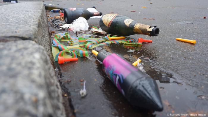 Germany Berlin |  Burned down fireworks and glass bottles