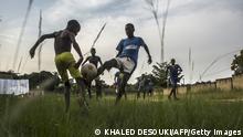 Gabonese boys play a football match in Franceville on January 17, 2017, as the Africa Cup of Nations tournament takes place in Gabon. / AFP / KHALED DESOUKI (Photo credit should read KHALED DESOUKI/AFP via Getty Images)