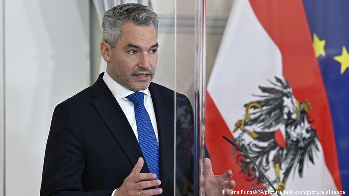 Austrian Chancellor Karl Nehammer gestures during a press conference
