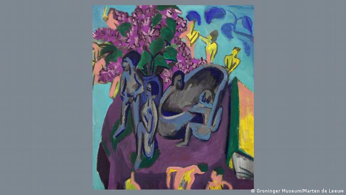 An abstract, multi-colored painting of naked figures and a table with a book and flowers on it