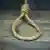 A noose resting on a table