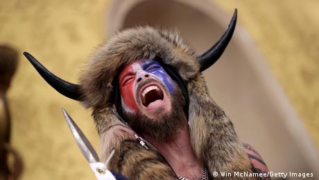 A protester screams Freedom inside the Senate chamber after the U.S. Capitol was breached by a mob during a joint session of Congress on January 6, 2021, in Washington, DC