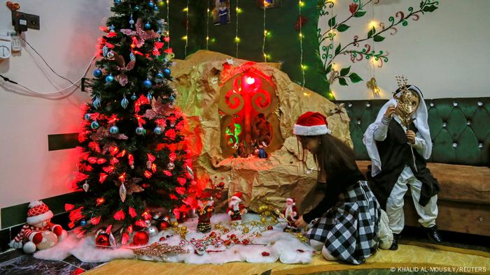  A Christian child decorates her home ahead of Christmas in al-Hamdaniya, Iraq December 18, 2021. 