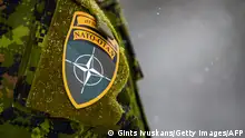 The NATO logo is seen on a uniform during the NATO annual military exercise Winter Shield 2021 in Adazi, Latvia, on November 29, 2021. (Photo by Gints Ivuskans / AFP) (Photo by GINTS IVUSKANS/AFP via Getty Images)
