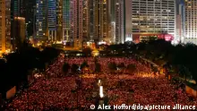 epa02765764 A general view shows thousands of people attending a candle-lit vigil to commemorate the pro-democracy students who died in an army crackdown on 04 June 1989 in Beijing's Tiananmen Square, Hong Kong, China, 04 June 2011. Hong Kongers planned to remember the anniversary of the bloody crackdown on the Tiananmen Square protests in Beijing 22 years ago at a candlelight vigil at the Victoria park in the former British colony the only place in China where such a large public commemoration is traditionally held. EPA/ALEX HOFFORD ++