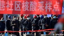 Construction workers line up to be tested for COVID in Xi'an, China