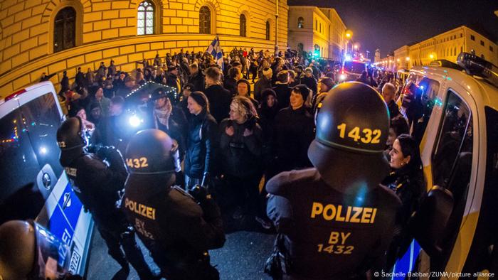 Protesters facing off with police in Munich