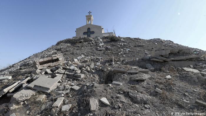 A view of the rubble of broken tombstones, damaged by Islamic State (IS) group fighters during their occupation of northern Iraq, at the Chaldean Monastery of St George (Mar Korkis) in Mosul.