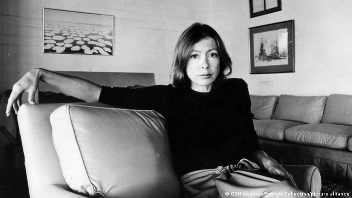 Joan Didion on a sofa