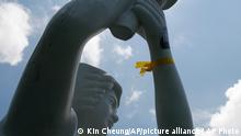 A statue of the Goddess of Democracy wearing a yellow ribbon is displayed in Hong Kong Thursday, June 4, 2015. Hong Kongers plan to hold a candlelight vigil Thursday night to mark the 1989 student-led Tiananmen Square protests, an annual event that takes on greater meaning for the city's young after last autumn's pro-democracy demonstrations sharpened their sense of unease with Beijing. (AP Photo/Kin Cheung)