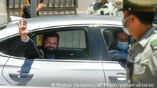 Chilean President-elect Gabriel Boric waves to supporters as he arrives to La Moneda presidential palace for a meeting with President Sebastian Pinera in Santiago, Chile, Monday, Dec. 20, 2021. (AP Photo/Matias Delacroix)