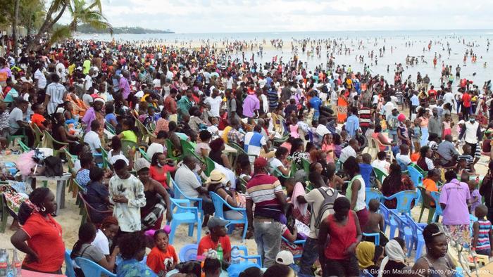 Holiday makers gather for Christmas at Jomo Kenyatta Public Beach near the city of Mombasa. The beach reopened to the public two months ago as COVID numbers went down. 