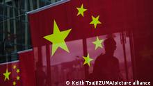 July 1, 2021, Hong Kong, China: China flags are seen with reflection of a man. Hong Kong celebrate the 100th anniversary of the founding of the Chinese Communist Party and the 24th anniversary of Hong Kong return to mainland China. (Credit Image: © Keith Tsuji/ZUMA Wire