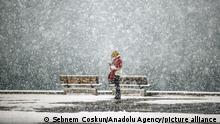 17.2.2021, Istanbul***
ISTANBUL, TURKEY - FEBRUARY 17: A woman checks her phone at Kadikoy Square during snowfall in Istanbul, Turkey on February 17, 2021. Sebnem Coskun / Anadolu Agency