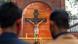 Christian devotees pray behind a police barricade outside Sacred Heart Cathedral Christian devotees pray behind a police barricade outside Sacred Heart Cathedral