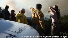 24.12.21 *** Forest guards check the area of a fire from Route 40, in Paraje Villegas, Rio Negro province, 70 km south of Bariloche, Argentina, on December 24, 2021. - Argentine Patagonia continues to be hit by forest fires that broke earlier this month in the provinces of Neuquén, Río Negro and Chubut following electric storms, and which have already affected more than 1,300 hectares. (Photo by Francisco RAMOS MEJIA / AFP) (Photo by FRANCISCO RAMOS MEJIA/AFP via Getty Images)