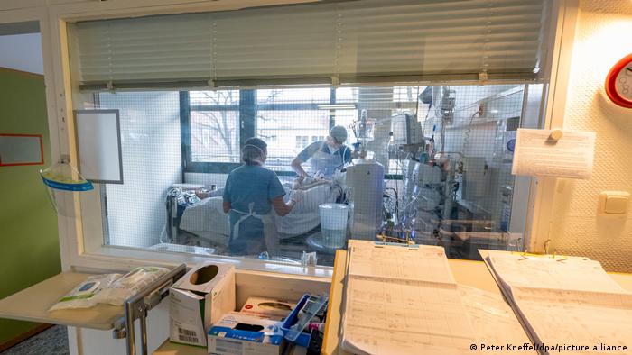  Medical personnel looking after a COVID patient in an intensive care unit in Munich