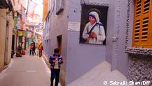 A poster of Mother Teresa on the wall of a building in the city of Kolkata