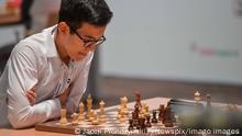 Nodirbek Abdusattorov playing chess at the Warsaw championship