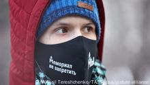 MOSCOW, RUSSIA - DECEMBER 29, 2021: A Memorial Society supporter is seen outside the Moscow City Court that continues to hear a lawsuit filed by the Russian Prosecutor General's Office against the Memorial Society international public organization (a non-profit organization declared a foreign agent in Russia). Earlier, the Russian Prosecutor General's Office filed a motion to disband the Memorial Society international public organization (a non-profit organization declared a foreign agent in Russia) and its subdivisions for violating the 'Foreign Agent' law. Founded in 1989, Memorial is an international historical society researching the political repressions and monitoring human rights in the present-day Russia and other post-Soviet states. The Memorial Society was declared a foreign agent in 2016. Mikhail Tereshchenko/TASS