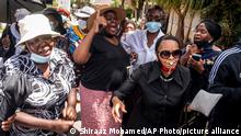 29.12.21 *** Women sing and dance at a memorial service held for Anglican Archbishop Emeritus Desmond Tutu at the Soweto home. Wednesday, Dec. 29, 2021. The Nobel Peace Prize-winning activist for racial equality and LGBT rights died Sunday at the age of 90. (AP Photo/Shiraaz Mohamed)