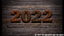 ***Symbolbild Jahreswechsel 2022***
2022 Happy New Year seasonal background with real wood background. Aged parquet of pine wood for flyer, posters or invitations. Copyright: xx 38655714