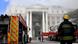 A firefighter looks at the smoke rising after a fire broke out in the Parliament in Cape Town, South Africa A firefighter looks at the smoke rising after a fire broke out in the Parliament in Cape Town, South Africa