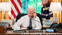 May 12, 2021 - Washington, District of Columbia, U.S. - President Joe Biden speaks on the phone with Israeli Prime Minister Benjamin Netanyahu on Wednesday, May 12, 2021, in the Oval Office of the . Washington U.S. - ZUMAz03_ 20210512_sso_z03_513 Copyright: xWhitexHousex