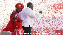 In this photo taken Saturday, Oct. 12, 2019, ruling Frelimo Party leader and President Filipe Nyusi, and his wife Isaura, at an election rally in Maputo, Mozambique. The country's elections on Tuesday, Oct 15, 2019 are almost certain to return the ruling party, Frelimo, and President Filipe Nyusi, to power but it is unclear if the results will establish badly needed stability and economic growth. (AP Photo/Ferhat Momade)