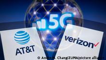 January 2, 2022, Asuncion, Paraguay: Illustration: In-camera multiple exposure image shows the logos of AT&T and Verizon on smartphone in front of signal bars, 5G acronym (fifth generation technology) and visual representation of nodes connected around planet Earth. (Credit Image: Â© Andre M. Chang/ZUMA Press Wire