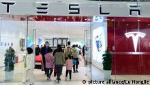 SHANGHAI, CHINA - DECEMBER 25, 2021 - Customers visit the Tesla Experience store at the Wanda Plaza store in Shanghai, China, on December 25, 2021.