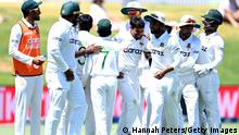 TAURANGA, NEW ZEALAND - JANUARY 05: Bangladesh celebrate the wicket of Trent Boult of the Black Caps caught by Taijul Islam of Bangladesh during day five of the First Test Match in the series between New Zealand and Bangladesh at Bay Oval on January 05, 2022 in Tauranga, New Zealand. (Photo by Hannah Peters/Getty Images)
