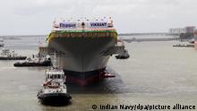 epa03821946 A handout picture provided by the Indian Navy shows India's first domestically built aircraft carrier, the INS Vikrant, docked at a shipyard in Kochi, India, 12 August 2013. With 37,500-ton aircraft carrier launch, India edged out China to join an elite group of countries that can design and build their own aircraft carriers, including the United States, Britain, France and Russia, news reports said. EPA/INDIAN NAVY / HANDOUT HANDOUT EDITORIAL USE ONLY/NO SALES ++