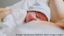Mother breastfeeding her newborn son in hospital Copyright: xAngelxSantamariax