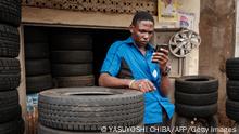 A man browses Facebook on his smart phone after the mobile internet went back online in Kampala, Uganda, on January 18, 2021. (Photo by YASUYOSHI CHIBA / AFP) (Photo by YASUYOSHI CHIBA/AFP via Getty Images)