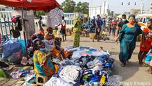 ACCRA, GHANA - December 22: Traders at the Kwame Nkrumah avenue road through to the Kantamanto market area displaying assorted goods comprising footwear, dresses, bags and cloths among others. Trading generally in Ghana at this time have taken a nosedive as there has been low patronage of goods a few days to the Christmas, as a result of Covid pandemic business activities takes a dramatic turn down on December 22, 2021 in Accra, Ghana. Photo by Gabriel Ahiabor. Copyright: xx 