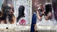20.08.2021, Kabul***
KABUL, AFGHANISTAN - AUGUST 20: Women posters on beauty salon windows remain vandalized in Kabul, Afghanistan on August 20, 2021. Haroon Sabawoon / Anadolu Agency