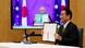 Japan's Prime Minister Fumio Kishida (R) and Australia's Prime Minister Scott Morrison show signed documents during a video meeting, in Tokyo, Japan January 6, 2022 Japan's Prime Minister Fumio Kishida (R) and Australia's Prime Minister Scott Morrison show signed documents during a video meeting, in Tokyo, Japan January 6, 2022