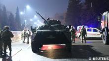 An armoured personnel carrier is seen near the mayor's office during protests triggered by fuel price increase in Almaty, Kazakhstan January 5, 2022. REUTERS/Stringer