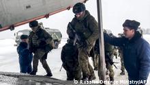 This handout image grab taken and released by the Russian Defence Ministry on January 6, 2021 shows Russian paratroopers boarding a military cargo plane to depart to Kazakhstan as a peacekeeping force at the Chkalovsky airport, outside Moscow. - A Moscow-led military alliance dispatched troops to help quell mounting unrest in Kazakhstan as police said dozens were killed trying to storm government buildings. Long seen as one the most stable of the ex-Soviet republics of Central Asia, energy-rich Kazakhstan is facing its biggest crisis in decades after days of protests over rising fuel prices escalated into widespread unrest. (Photo by Handout / Russian Defence Ministry / AFP) / RESTRICTED TO EDITORIAL USE - MANDATORY CREDIT AFP PHOTO / Russian Defence Ministry - NO MARKETING - NO ADVERTISING CAMPAIGNS - DISTRIBUTED AS A SERVICE TO CLIENTS
