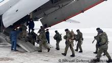 This handout image grab taken and released by the Russian Defence Ministry on January 6, 2021 shows Russian paratroopers boarding a military cargo plane to depart to Kazakhstan as a peacekeeping force at the Chkalovsky airport, outside Moscow. - A Moscow-led military alliance dispatched troops to help quell mounting unrest in Kazakhstan as police said dozens were killed trying to storm government buildings. Long seen as one the most stable of the ex-Soviet republics of Central Asia, energy-rich Kazakhstan is facing its biggest crisis in decades after days of protests over rising fuel prices escalated into widespread unrest. (Photo by Handout / Russian Defence Ministry / AFP) / RESTRICTED TO EDITORIAL USE - MANDATORY CREDIT AFP PHOTO / Russian Defence Ministry - NO MARKETING - NO ADVERTISING CAMPAIGNS - DISTRIBUTED AS A SERVICE TO CLIENTS