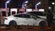 A security guard walks past Tesla cars being charged in Beijing, China A security guard walks past Tesla cars being charged in Beijing, China