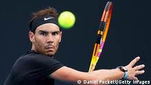 MELBOURNE, AUSTRALIA - JANUARY 04: Rafael Nadal of Spain plays a forehand shot in his doubles match with Jaume Munar of Spain against Sebastian Baez and Tomas Martin Etcheverry of Argentina during the Melbourne Summer Set at Melbourne Park on January 04, 2022 in Melbourne, Australia. (Photo by Daniel Pockett/Getty Images)