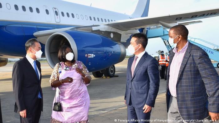 Chinese Foreign Minister Wang Yi is welcomed by Foreign Minister of Kenya Raychelle Omamo, upon his arrival in the coastal city of Mombasa