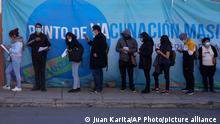 People line up for shot of the Sinopharm COVID-19 vaccine during a vaccination campaign for people over 18 in La Paz, Bolivia, Monday, July 12, 2021. (AP Photo/Juan Karita)