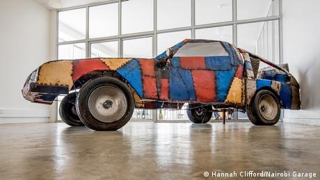 A patchwork, multi-colored model of a lifesize car in Kenya's Nairobi Garage